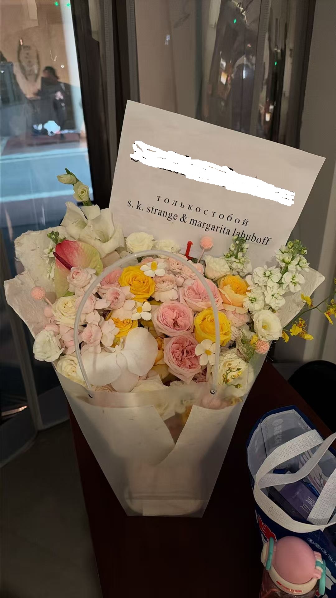 A fresh birthday bouquet waiting at a theatre entrance checkpoint in Nanjing China